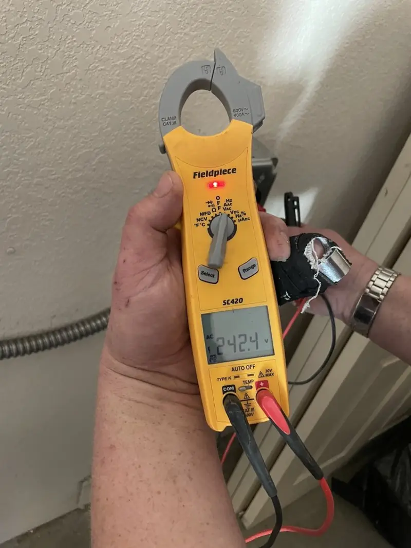 Voltage testing with clamp meter during Generator Installation in San Tan Valley
